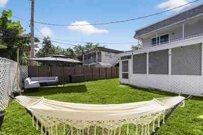 a hammock in the backyard of a house at 3-BDR Guitar House, Walk to Casino, located close to EVERYTHING! in Fort Lauderdale