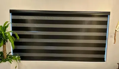 a black and grey striped window blind on a wall at Home in Heart of Wilton Drive, 4 Mi to Beach in Fort Lauderdale