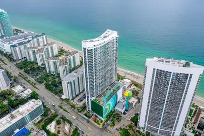an aerial view of two tall buildings next to the ocean at Luxurious Beachfront 2-Bedroom 2-Bathroom with balcony Condo at Lyft Resort & Residences - Miami Beach in Hollywood
