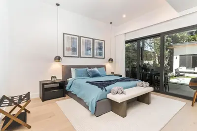 a bedroom with a bed and a large window at Luxury Miami Oasis with Heated Pool and BBQ Grill in Miami