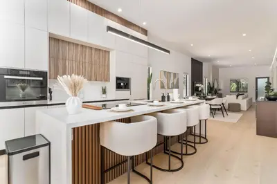 a kitchen with a bar with stools at Luxury Miami Oasis with Heated Pool and BBQ Grill in Miami