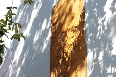 a shadow of a building with the sun shining on it at The Lemon Branch Hotel in Miami Beach