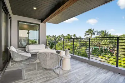 a balcony with chairs and a view of the ocean at Shoreline Villa by Rove - Rooftop & Beach Access in Hollywood