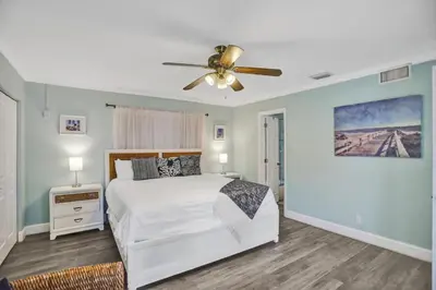 a bedroom with a bed and a ceiling fan at Waterfront, Heated Pool, Game Room in Fort Lauderdale