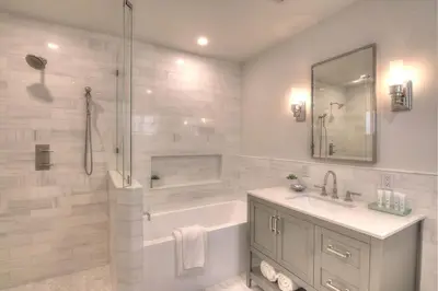 a bathroom with a tub and a sink and a shower at Beach Oasis Heated Pool, Gazebo, Hot Tub in Fort Lauderdale