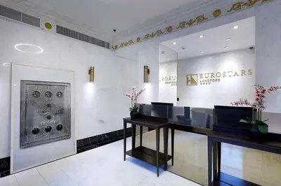 a lobby with a desk in the middle of a room at Eurostars Langford in Miami