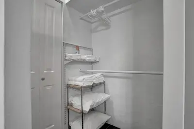 a bathroom with a towel rack with towels at Fun Location! 1 block to Las Olas Pool & Parking in Fort Lauderdale