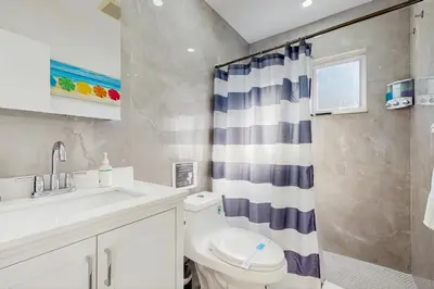 a bathroom with a toilet and a sink at JS & JS 2040 LLC in Fort Lauderdale
