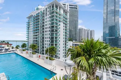 an image of a large building with a swimming pool at Stylish Brickell Stay with Ocean Views & Pool in Miami