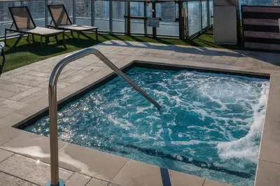 a hot tub on top of a building at Lyfe Resort l Ocean Pool View Gym, Beach Access in Hollywood