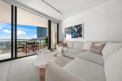 a living room with a couch and a large window at OceanView 1B Private Residence at South Beach - 514 in Miami Beach