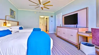 a large bedroom with a large bed and a flat screen tv at Modern Miami Suite Near the Beach in Miami