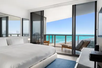 a bedroom with a bed and a view of the ocean at OceanView 1B Private Residence at South Beach -1614 in Miami Beach