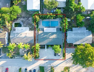 an overhead view of a building with trees and buildings at Wilton Manors Twin Oasis | 2 Heated Pools, For 12 in Fort Lauderdale
