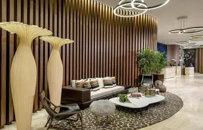 a living room with a couch and a table at Lyfe Resort & Residences in Hollywood