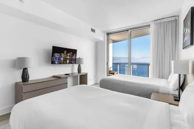 a hotel room with two beds and a window at Ocean Luxe Pad for 6 Guests with Poolside Access in Hollywood