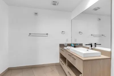 a white bathroom with a sink and a mirror at Ocean Luxe Pad for 6 Guests with Poolside Access in Hollywood