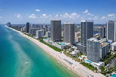 an aerial view of a beach in front of a city at Ocean Luxe Pad for 6 Guests with Poolside Access in Hollywood