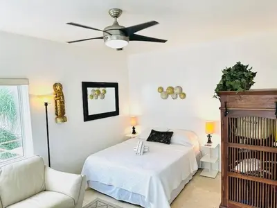 a bedroom with a bed and a ceiling fan at South Beach Paradise Jr Suite next to Convention Center in Miami Beach