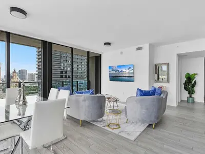 a living room with a view of a city at X Lounge VIII-Prime Corner Residence in Miami