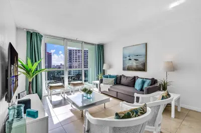a living room with a couch and a table at Family-Friendly Beach Condo Steps to the Ocean- 9th floor in Hollywood Beach