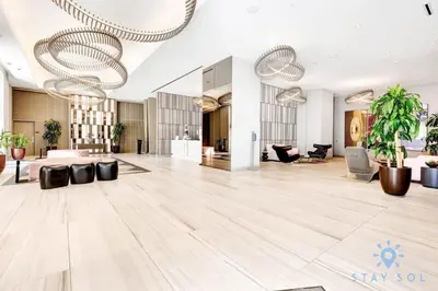 a lobby of a hotel with a large room at Oceanfront Escape with Resort-Style Amenities in Hollywood
