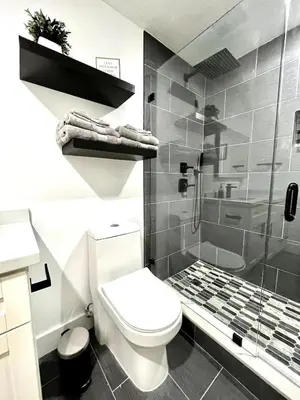 a bathroom with a toilet and a shower at Lovely and Private Studio
