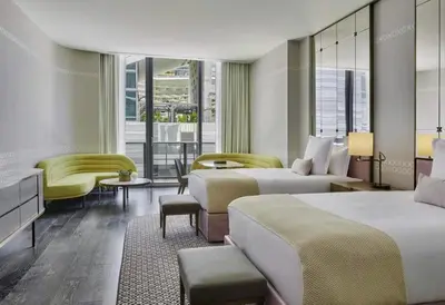 a hotel room with two beds and a couch at SLS Lux Brickell Exclusive by Palermo Home Miami in Miami