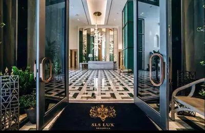 a lobby of a hotel with a glass door at SLS Lux Brickell Exclusive by Palermo Home Miami in Miami