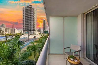 a balcony with a view of a city skyline at Amazing 2 BR Apartment Pool & Near Beach in Hallandale Beach