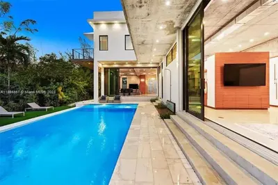 a swimming pool in the backyard of a house at Villa Retro Mirage in Biscayne Park