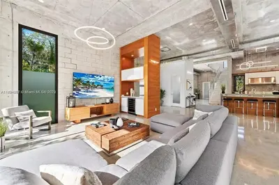 a living room with a couch and a table at Villa Retro Mirage in Biscayne Park