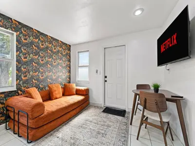 a living room with a couch and a table at Studio Sol Little Havana Retreat in Miami
