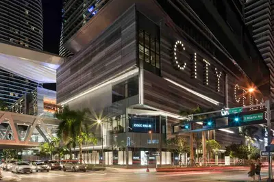 a building on a city street at night at Stylish 1BR Modern Apt in Brickell - Free Parking in Miami