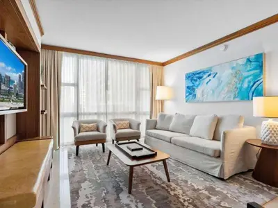 a living room with a couch and a table at Villa Seafoam in Miami Beach