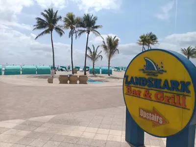 a sign for an island shark bar and grill on the beach at The Hollywood Beach Experience in Hollywood