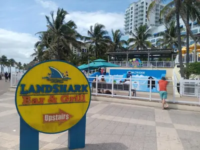 a sign for a bar and grill on the beach at The Hollywood Beach Experience in Hollywood