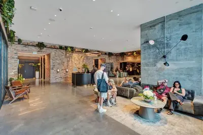 a group of people sitting in a living room at Miami Lux Studio w. Kitchen City and Bay Views in Miami
