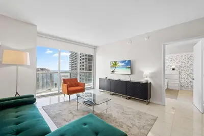 a living room with a couch and a chair at Luxury Waterfront Brickell ICON W-Hotel Balcony Water Views in Miami