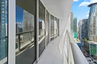 a balcony in a skyscraper with views of the city at Luxury Waterfront Brickell ICON W-Hotel Balcony Water Views in Miami