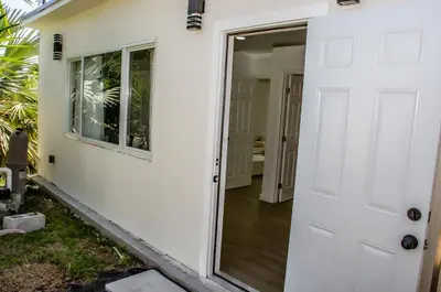 a door leading into a house with a porch at Comfy and Relaxed in Cutler Bay