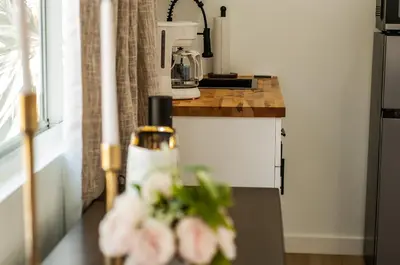 a kitchen with a counter with pink flowers on it at Comfy and Relaxed in Cutler Bay