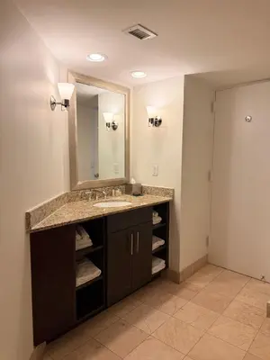 a bathroom with a sink and a mirror at Sunrise on the Intracoastal in Fort Lauderdale