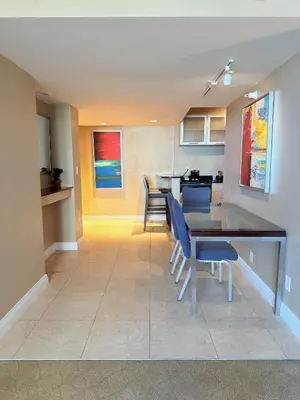 a dining room and kitchen with a table and chairs at Sunrise on the Intracoastal in Fort Lauderdale