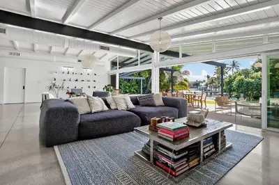 a living room with a couch and a table at Isla Solana by Rove Travel - Waterfront with Pool in Miami