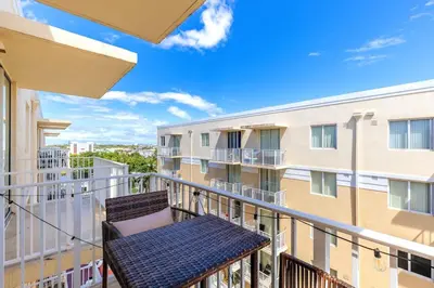 a balcony with a bench on a building at 1 Bedroom Apt With Patio in South Riverside in Miami