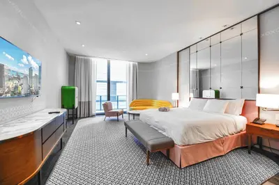 a hotel room with a large bed and a television at GREAT STUDIO - Luxe Brickell Stay Near Bay in Miami
