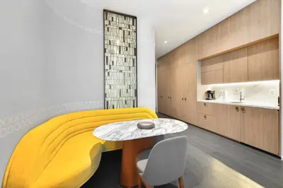 a bedroom with a yellow bed and a table at GREAT STUDIO - Luxe Brickell Stay Near Bay in Miami