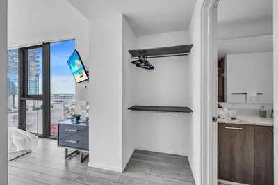 a white kitchen with a sink and a counter at Waterline Corner Vies 2Br 2BA Suites in Miami