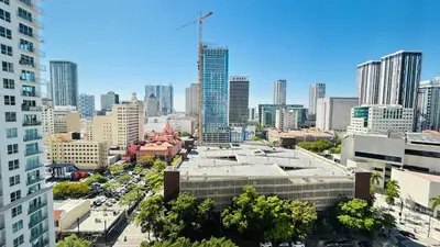 an aerial view of a city with a building at Contemporary Comfort Rooftop Views & Full Kitchen in Miami